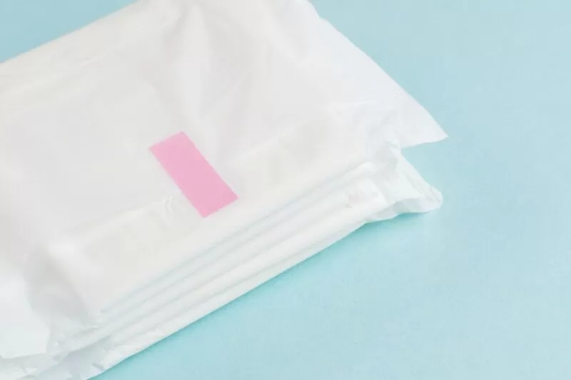 pads for DIY postpartum care kit on blue background