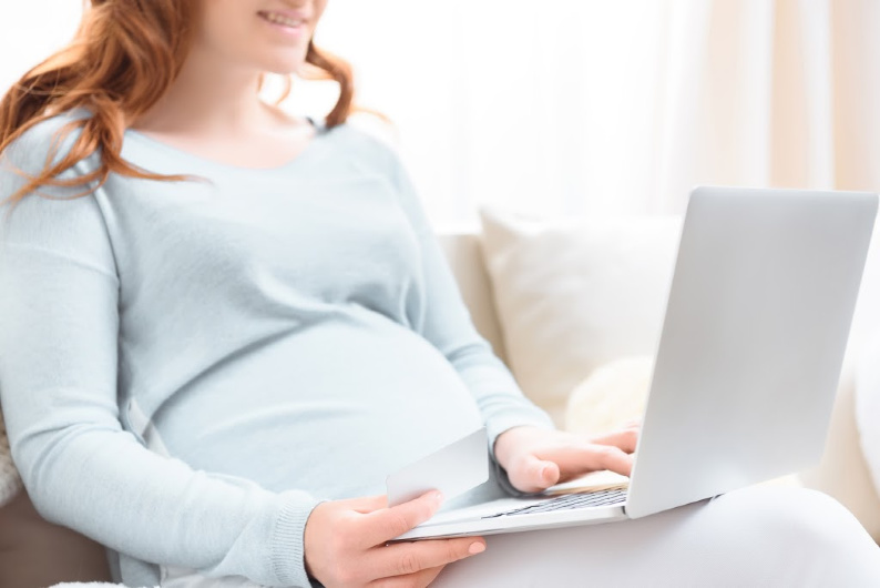 pregnant woman ordering pregnancy essentials online.