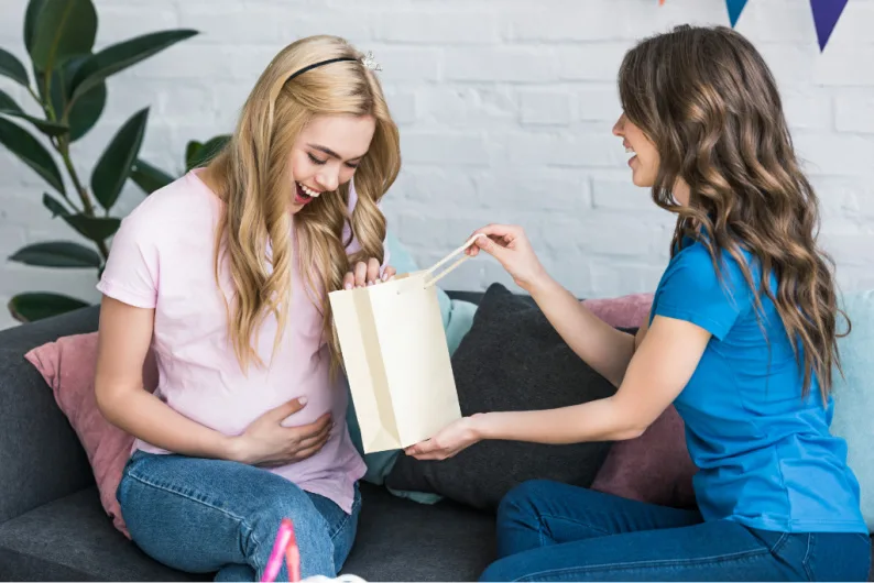 minimalist mom receiving baby shower gifts