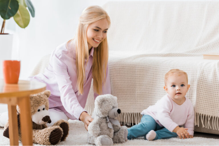 mom playing with baby using minimalist baby toys