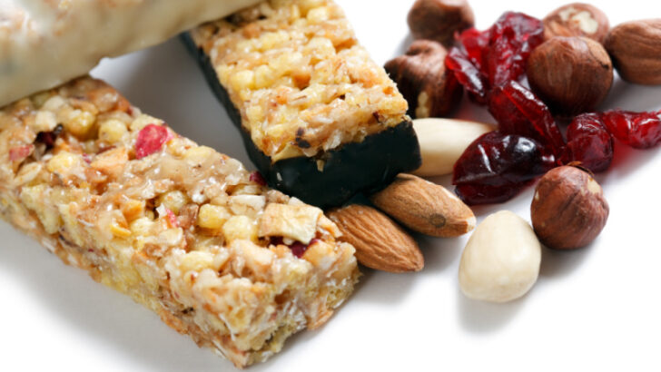 healthy snacks for hospital bag, granola bars, nuts and craisins on white.