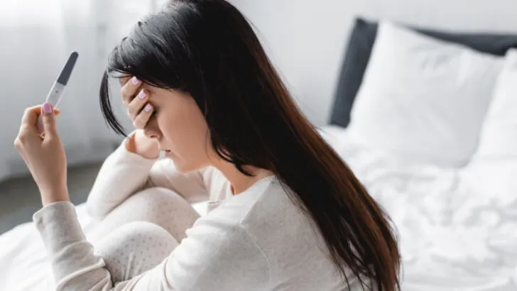 woman struggling with infertility devastated by negative pregnancy test