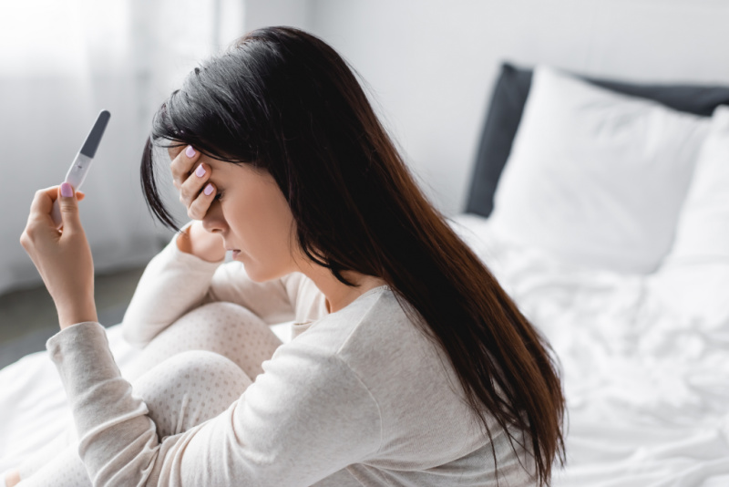 woman struggling with infertility devastated by negative pregnancy test