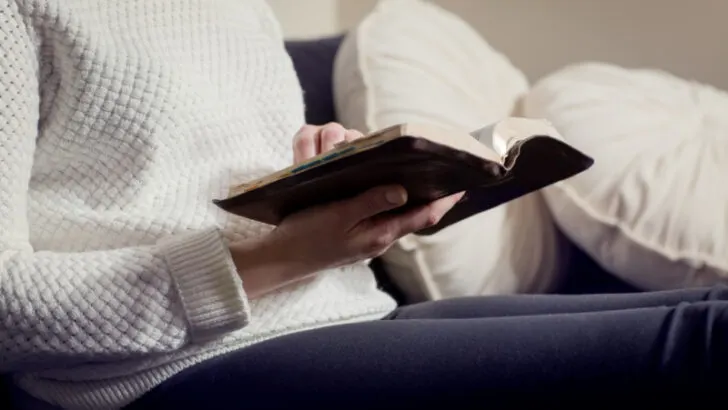 woman who is trying to conceive reading the Bible