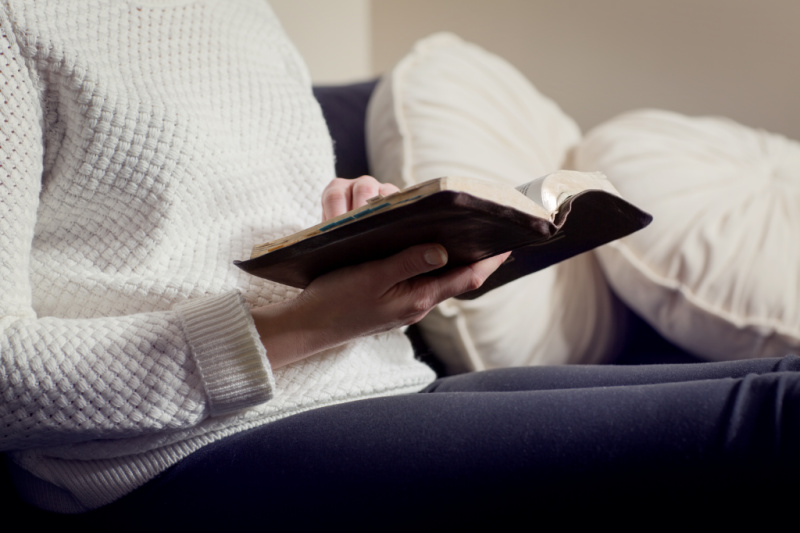 woman who is trying to conceive reading the Bible