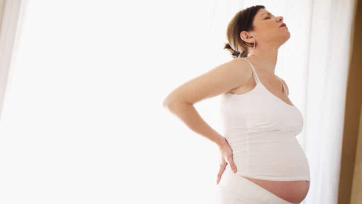 pregnant woman struggling with back pain