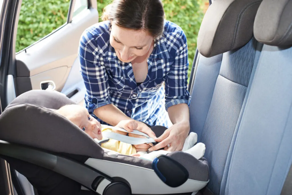 mom practicing self care by preparing to go for a drive with her baby