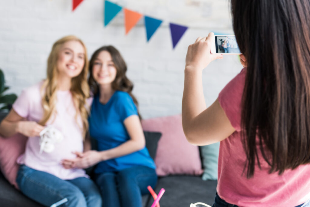 women taking photo together at baby shower