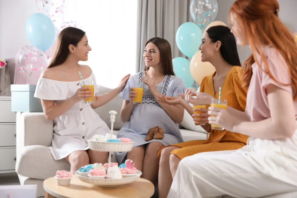 women talking and drinking yummy beverages at baby shower