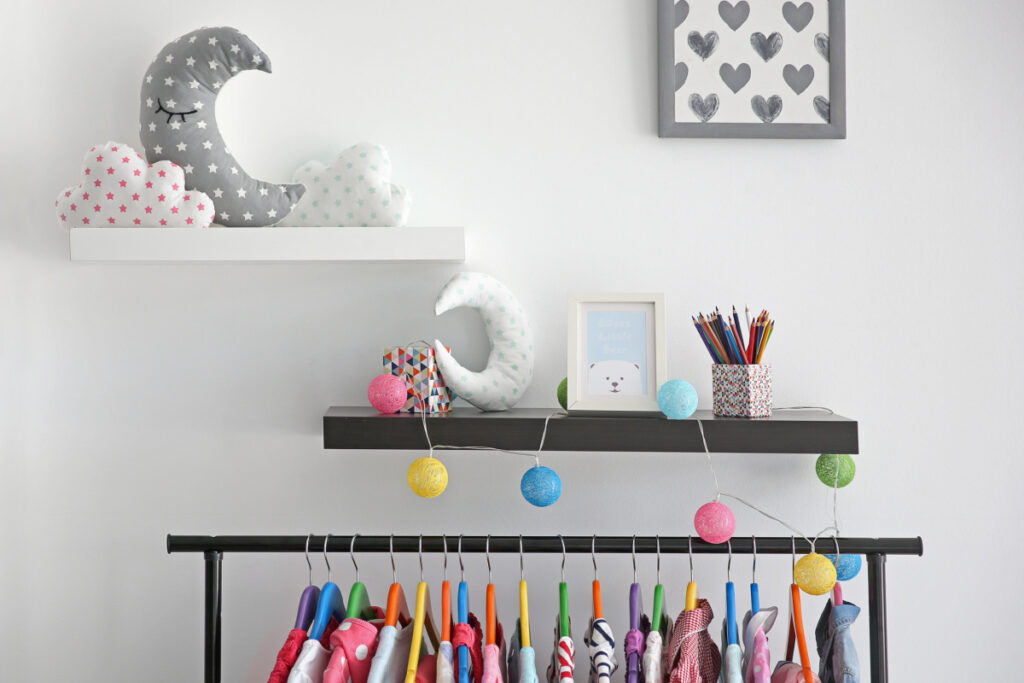 floating wall shelves for organizing baby clothes