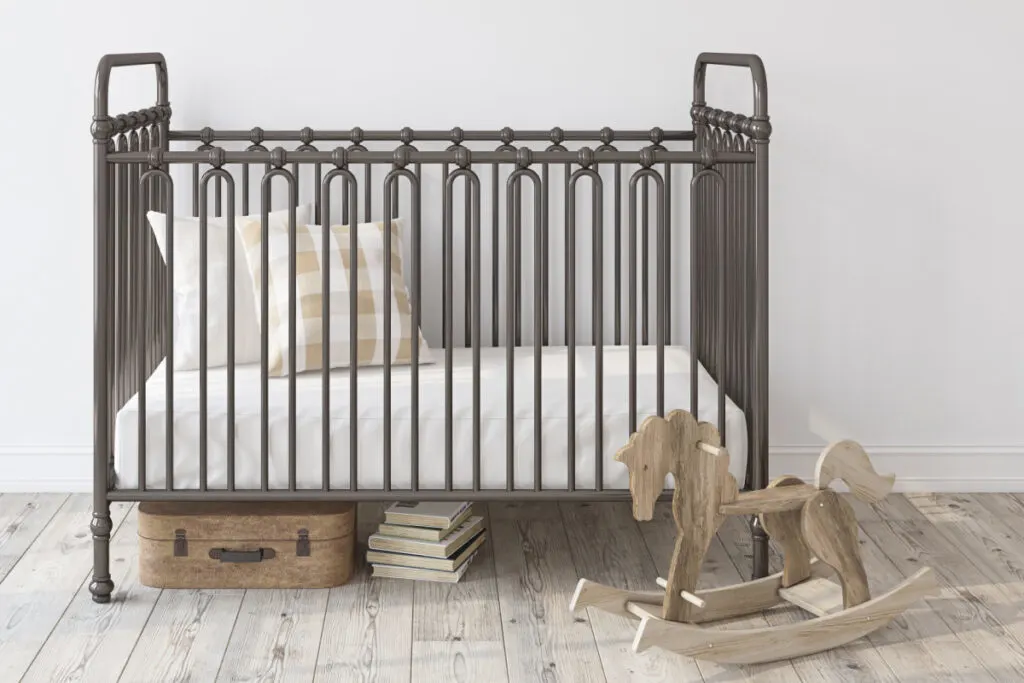 crib with mattress lowered all the way to keep baby from climbing out 