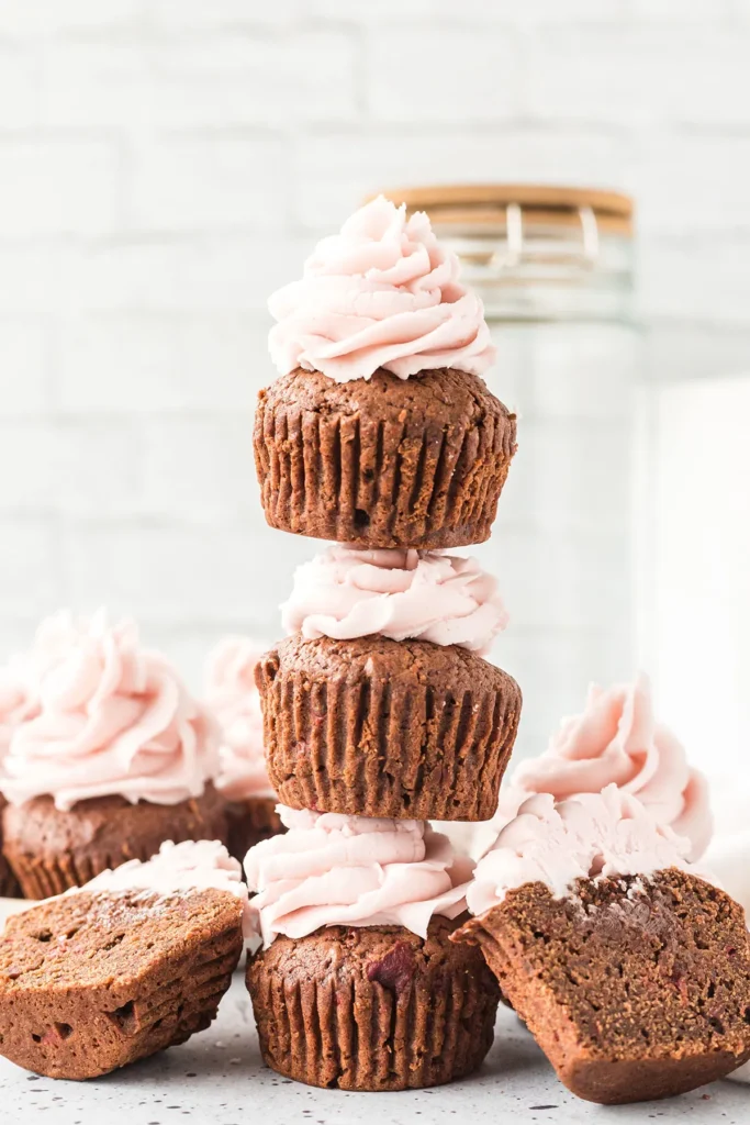 chocolate cherry cupcakes stacked on top of one another.