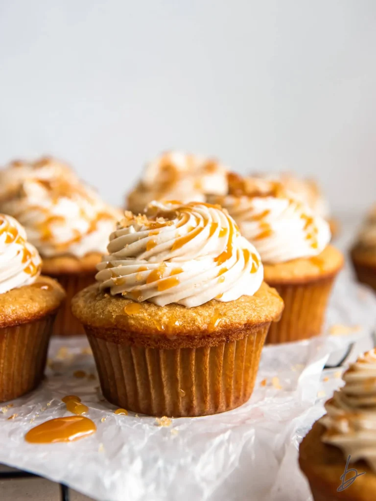 brown sugar cupcakes topped with caramel drizzle.