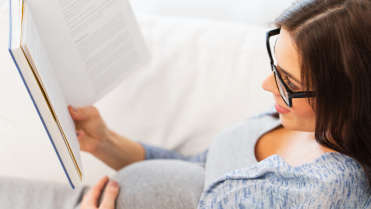pregnant woman reading about what to expect during labor