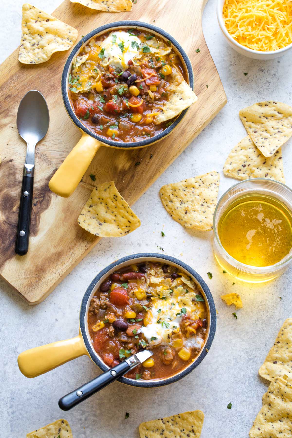 taco soup in bowls with tortilla chips and juice