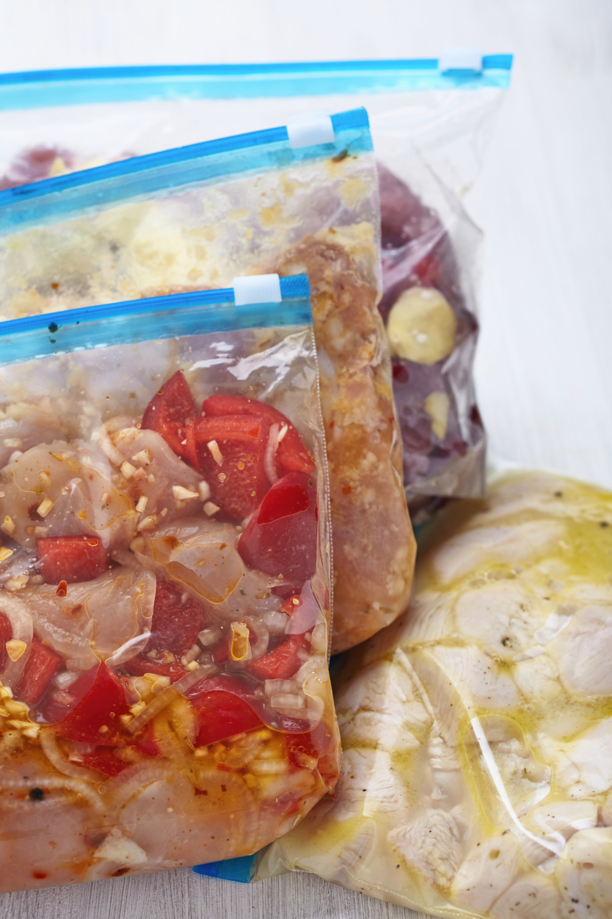 crockpot meal ingredients assembled in ziplock bags to freeze.