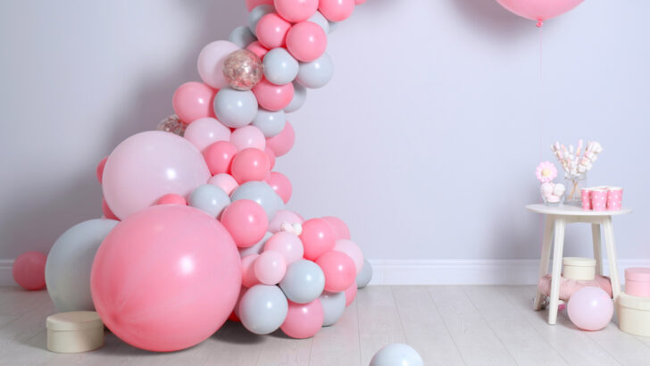 pink and blue balloon arch for budget baby shower