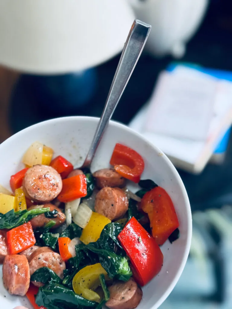Costco chicken sausage stir fry in white bowl.