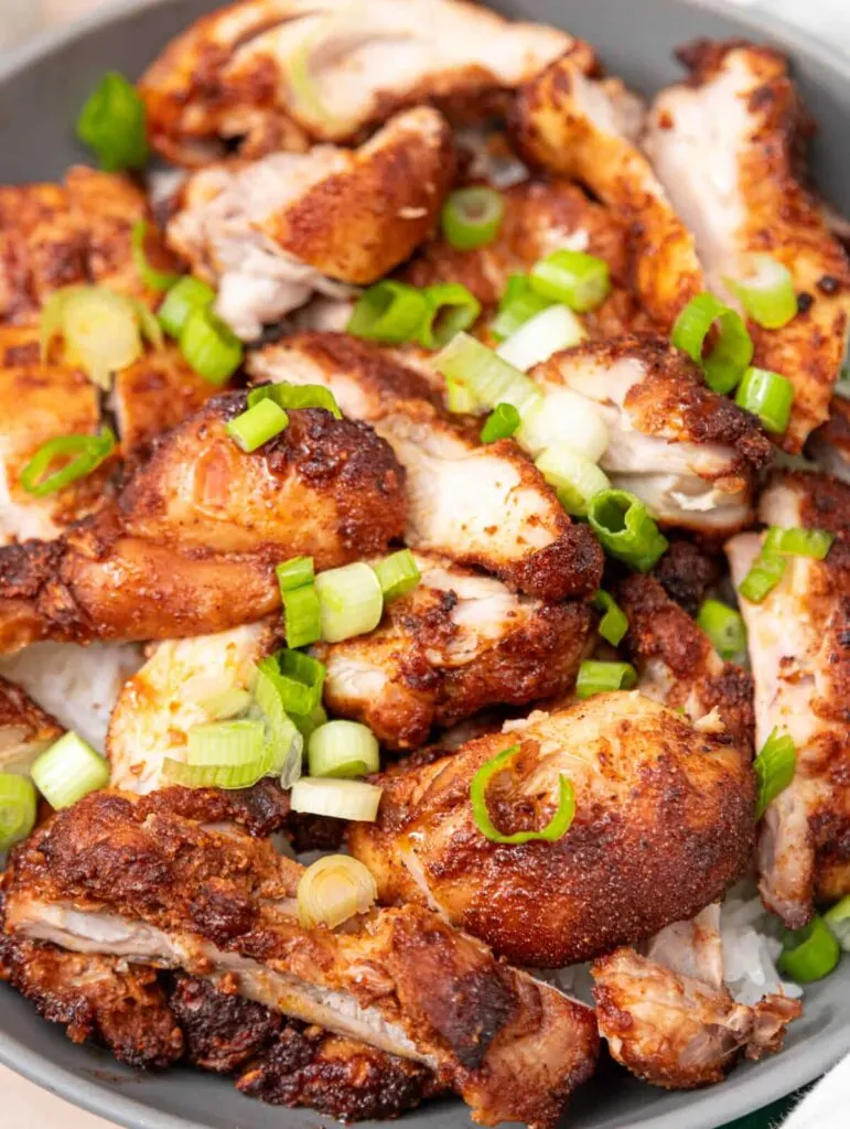 hot honey chicken topped with green scallions.