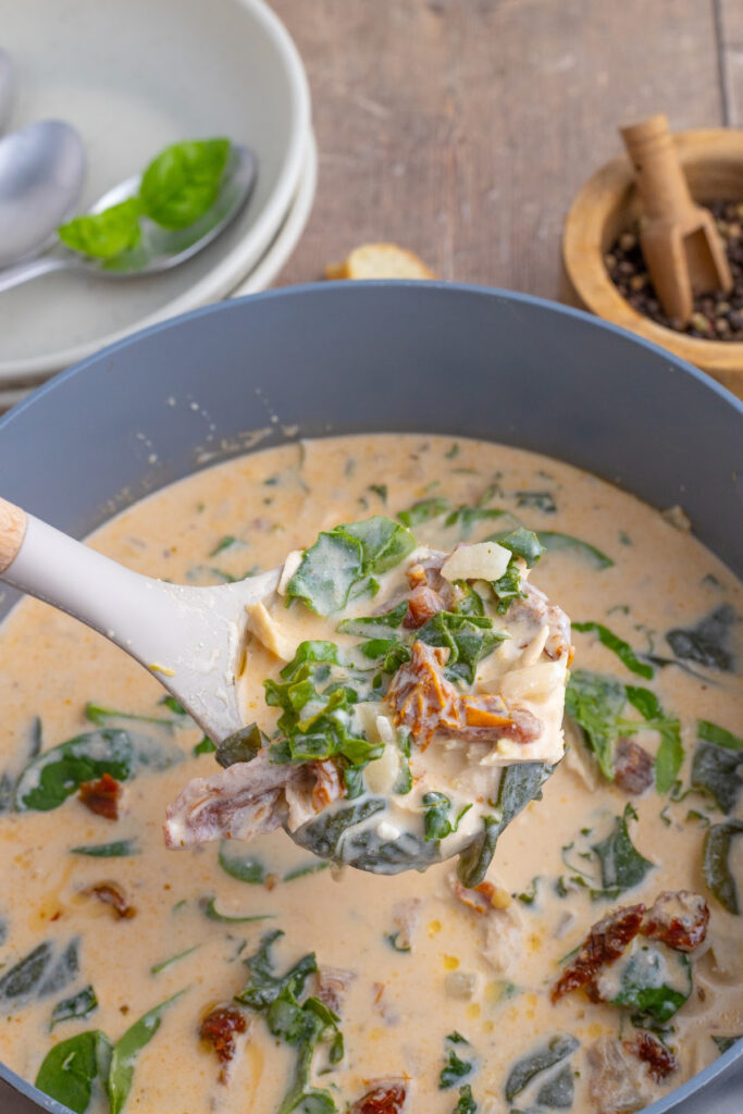 Marry Me Chicken Soup in pot with ladle.
