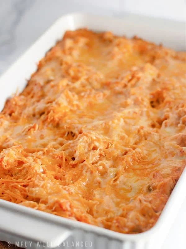 chicken taco spaghetti casserole in white casserole dish.
