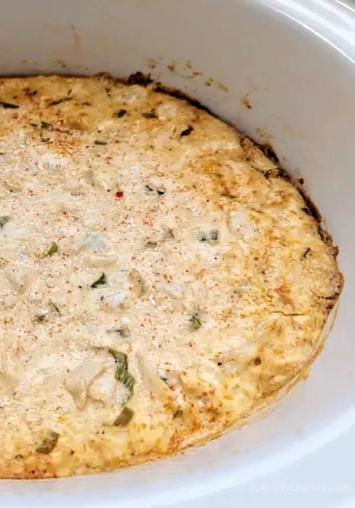 crab creole dip in white slow cooker, ready to serve.